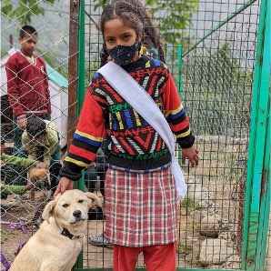 Compassion Education - school girl with a dog